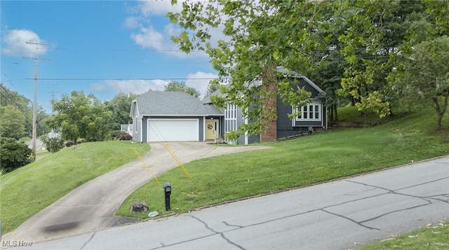 1096 Colegate Dr, Marietta, OH 45750 - view of front facade featuring a front lawn, driveway, and a garage