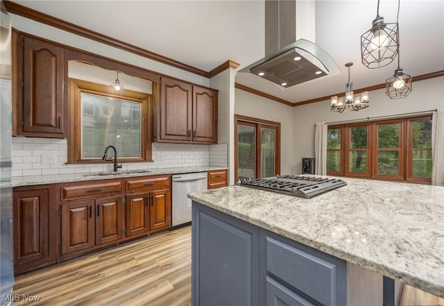 1096 Colegate Dr, Marietta, OH 45750 - kitchen with appliances with stainless steel finishes, island exhaust hood, light wood finished floors, light stone countertops, and ornamental molding