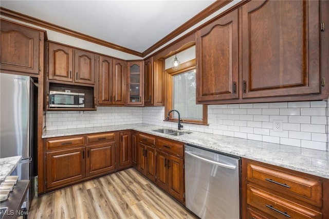 1096 Colegate Dr, Marietta, OH 45750 - kitchen featuring stainless steel appliances, light stone countertops, ornamental molding, backsplash, and light wood-type flooring