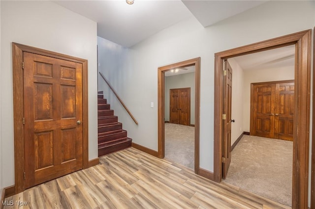 1096 Colegate Dr, Marietta, OH 45750 - hall featuring light wood finished floors and stairs