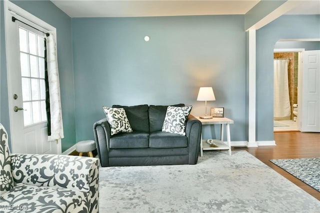364 Meadowbrook Ave SE, Warren, OH 44483 - living room with wood finished floors, healthy amount of natural light, and arched walkways