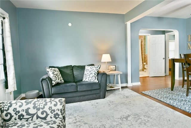 364 Meadowbrook Ave SE, Warren, OH 44483 - living room featuring arched walkways and wood finished floors