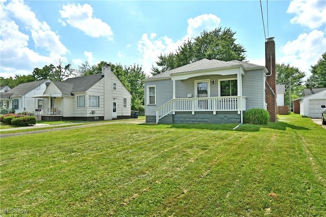 364 Meadowbrook Ave SE, Warren, OH 44483 - bungalow-style house with a chimney, a front lawn, and covered porch