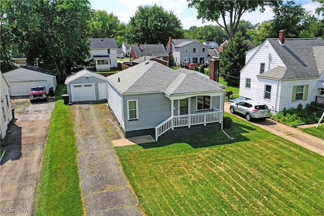364 Meadowbrook Ave SE, Warren, OH 44483 - view of front of property featuring a porch, a detached garage, a front lawn, and a residential view