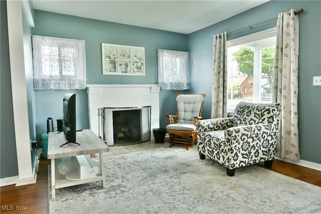 364 Meadowbrook Ave SE, Warren, OH 44483 - sitting room with a fireplace and wood finished floors