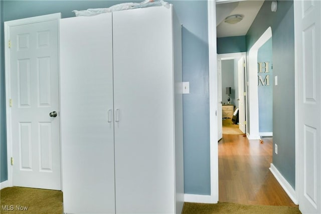 364 Meadowbrook Ave SE, Warren, OH 44483 - hall with baseboards and wood finished floors