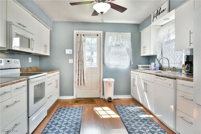 364 Meadowbrook Ave SE, Warren, OH 44483 - kitchen featuring white appliances, ceiling fan, light wood finished floors, and white cabinetry