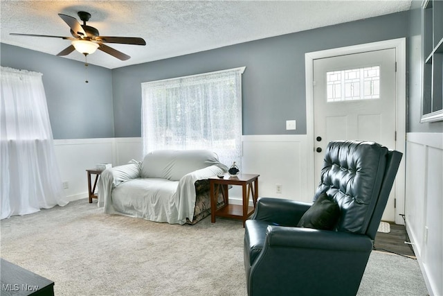33 Mcdonald Ave, Niles, OH 44446 - sitting room with ceiling fan, a wainscoted wall, a textured ceiling, and carpet floors