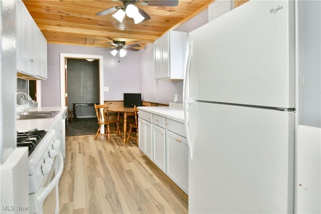33 Mcdonald Ave, Niles, OH 44446 - kitchen featuring white appliances, ceiling fan, light wood finished floors, wood ceiling, and light countertops