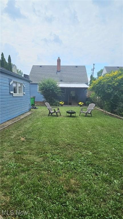 25801 Zeman Ave, Euclid, OH 44132 - back of property featuring a lawn and a chimney