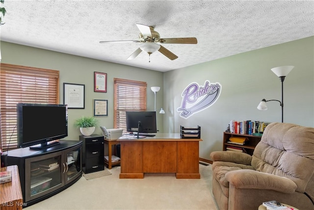 2785 Chalford Cir NW, North Canton, OH 44720 - home office with light carpet, ceiling fan, and a textured ceiling