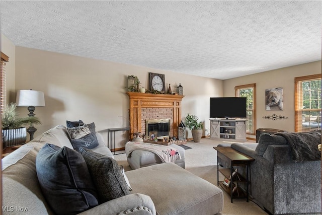 2785 Chalford Cir NW, North Canton, OH 44720 - living room featuring a textured ceiling, light colored carpet, and a fireplace