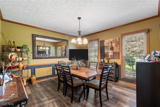 2785 Chalford Cir NW, North Canton, OH 44720 - dining area with a chandelier, dark wood-style flooring, crown molding, and a textured ceiling
