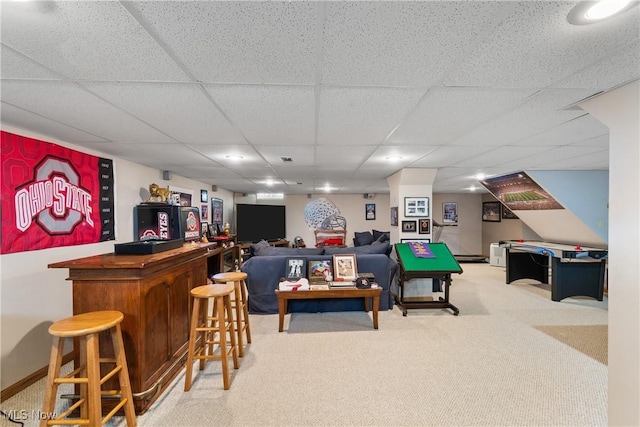 2785 Chalford Cir NW, North Canton, OH 44720 - carpeted living room featuring a dry bar and a paneled ceiling