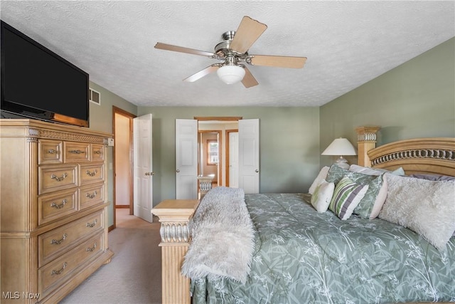 2785 Chalford Cir NW, North Canton, OH 44720 - bedroom featuring carpet floors, ceiling fan, and a textured ceiling