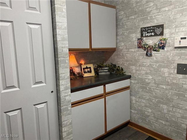 2785 Chalford Cir NW, North Canton, OH 44720 - kitchen featuring dark countertops, white cabinets, and dark wood-style floors