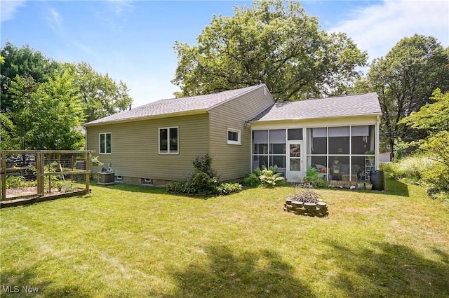 593 Mardon Ave, Akron, OH 44303 - rear view of property with a fire pit, a sunroom, a yard, and a garden