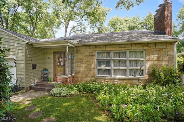 593 Mardon Ave, Akron, OH 44303 - view of front of house with stone siding and a chimney