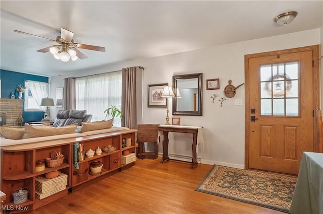 593 Mardon Ave, Akron, OH 44303 - entryway featuring ceiling fan, light wood-style flooring, and a stone fireplace