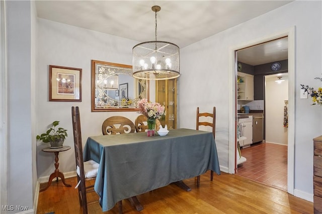 593 Mardon Ave, Akron, OH 44303 - dining space featuring a chandelier and wood finished floors