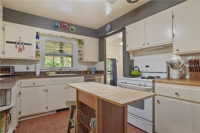 593 Mardon Ave, Akron, OH 44303 - kitchen featuring gas range gas stove, open shelves, butcher block countertops, and decorative backsplash