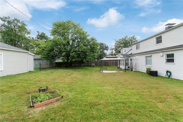 4221 2nd St NW, Canton, OH 44708 - fenced yard featuring a vegetable garden