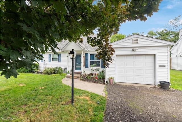 4221 2nd St NW, Canton, OH 44708 - view of front of house with a front yard, driveway, and a garage