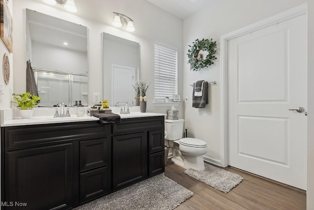 2014 Sugar Maple Dr, Kent, OH 44240 - full bathroom with an enclosed shower, double vanity, and wood finished floors