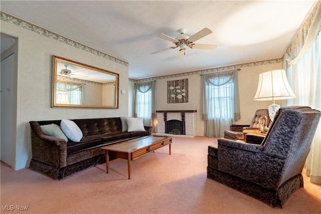 409 Yager Rd, New Franklin, OH 44216 - carpeted living room with healthy amount of natural light, ceiling fan, and a brick fireplace