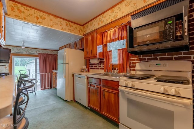 409 Yager Rd, New Franklin, OH 44216 - kitchen with white appliances, wallpapered walls, light countertops, brown cabinets, and crown molding