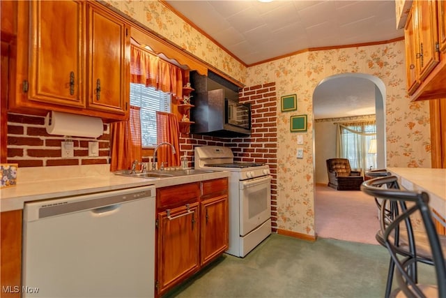 409 Yager Rd, New Franklin, OH 44216 - kitchen featuring white appliances, wallpapered walls, ornamental molding, arched walkways, and carpet floors
