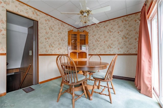 409 Yager Rd, New Franklin, OH 44216 - carpeted dining area featuring crown molding, ceiling fan, and a wainscoted wall