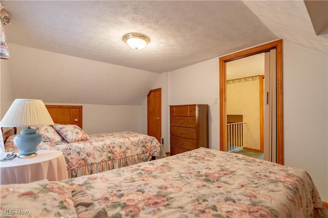 409 Yager Rd, New Franklin, OH 44216 - bedroom with a textured ceiling and vaulted ceiling