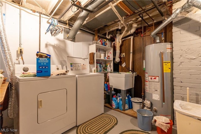 409 Yager Rd, New Franklin, OH 44216 - washroom featuring gas water heater, separate washer and dryer, and brick wall