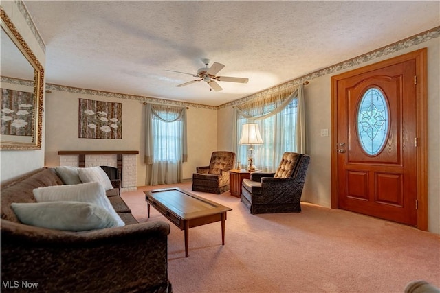 409 Yager Rd, New Franklin, OH 44216 - living area featuring a ceiling fan, carpet, a textured ceiling, and a fireplace