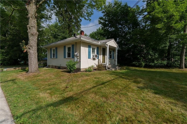 188 Stratford Ave, Wadsworth, OH 44281 - view of side of property featuring a chimney and a lawn