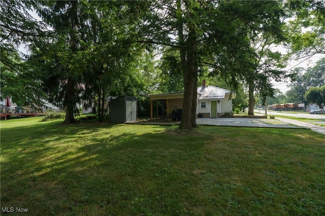188 Stratford Ave, Wadsworth, OH 44281 - view of grassy yard featuring a storage shed