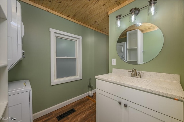 188 Stratford Ave, Wadsworth, OH 44281 - bathroom featuring washer / clothes dryer, wood ceiling, vanity, and wood finished floors