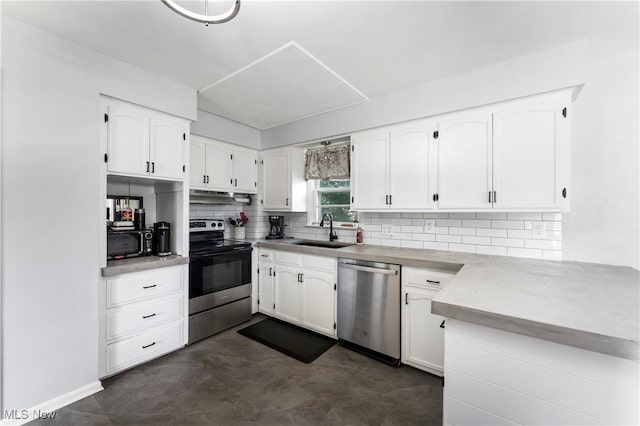 1103 Clinton Ave SE, North Canton, OH 44720 - kitchen with stainless steel appliances, decorative backsplash, white cabinetry, and under cabinet range hood