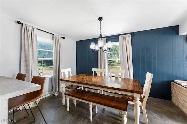 1103 Clinton Ave SE, North Canton, OH 44720 - dining space with a chandelier and concrete floors