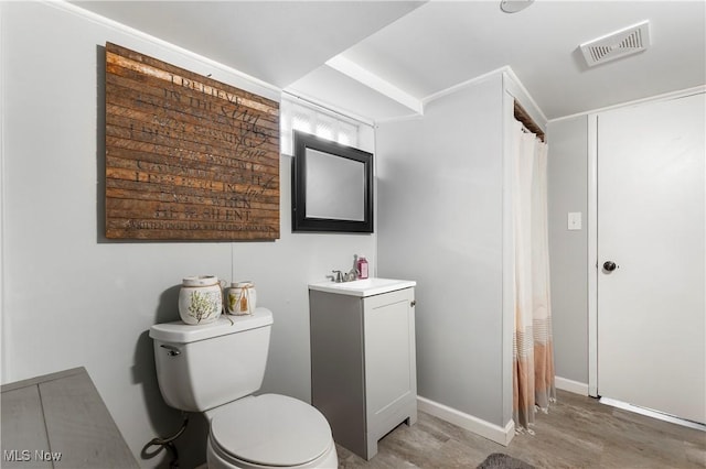 1103 Clinton Ave SE, North Canton, OH 44720 - full bath with wood finished floors, vanity, and a shower with curtain