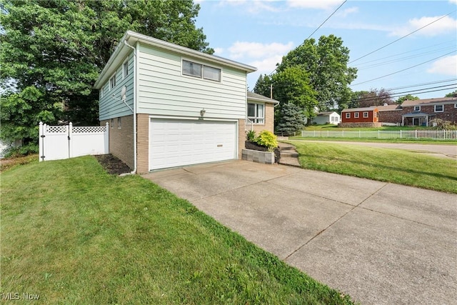 1103 Clinton Ave SE, North Canton, OH 44720 - view of front of house with an attached garage, brick siding, and driveway