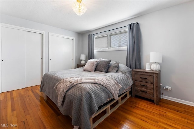 1103 Clinton Ave SE, North Canton, OH 44720 - bedroom with multiple closets and wood finished floors