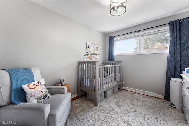 1103 Clinton Ave SE, North Canton, OH 44720 - bedroom with a baseboard radiator and a nursery area