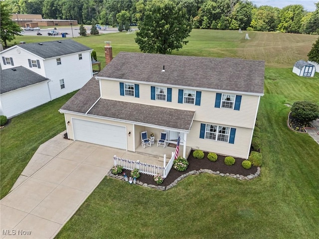 136 Westchester Dr, Brunswick, OH 44212 - view of front facade with driveway, a front lawn, an attached garage, roof with shingles, and a chimney