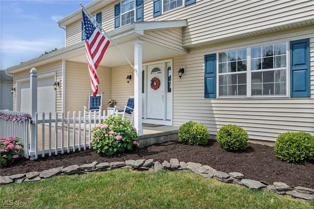 136 Westchester Dr, Brunswick, OH 44212 - view of exterior entry with covered porch and an attached garage