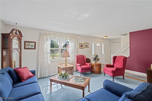 136 Westchester Dr, Brunswick, OH 44212 - living room with carpet flooring, stairway, and a textured ceiling