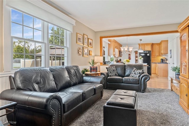 136 Westchester Dr, Brunswick, OH 44212 - living area with a chandelier and wainscoting