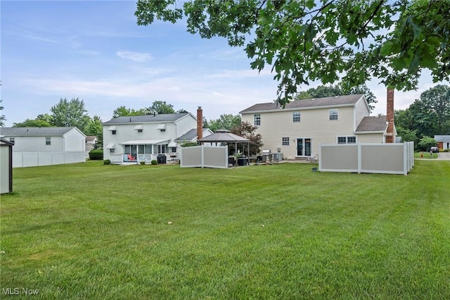 136 Westchester Dr, Brunswick, OH 44212 - back of property with a gazebo and a chimney