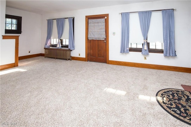 1299 Herberich Ave, Akron, OH 44301 - carpeted living area with radiator and baseboards